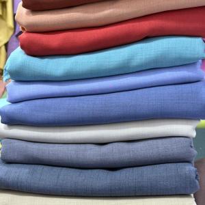 Stacks of colorful Cotton fabrics 4 yards each.