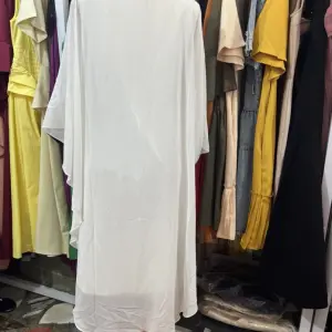 White Kaftan Dress featuring Colorful, Nature-inspired Embroidery.