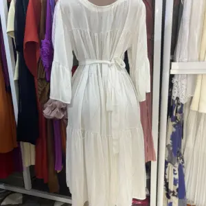 White, Long-Sleeved, tiered Maxi Dress featuring a fitted waist and flared cuffs. (Free Size)