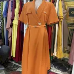 Tailored Silhouette with a Collared neckline, short sleeves, and a matching belt