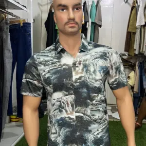 Short-Sleeved Men's Button-down Shirt with a Bold, Abstract Pattern.