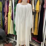 White Kaftan-Style Maxi Dress, Flowing Silhouette with wide, draped Sleeves and a simple round or scoop neckline.