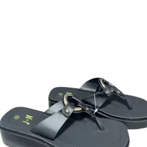 black wedge platform and distinctive gold-tone metal hardware on the T-strap