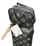 Travel Set includes a Rolling Suitcase and a Smaller Matching Bag, that Showcases Black and White star and monogram pattern