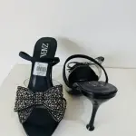 Zara Bow High Heel Sandals in a diamante-encrusted bow on the instep and a side buckle.