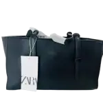 Zara Tote in Black is a sophisticated Handbag featuring Multiple storage areas for organization.