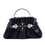 Vintage-inspired Black pleated Evening Clutch in "pouch" Silhouette with Opulent Hardware and Texture.