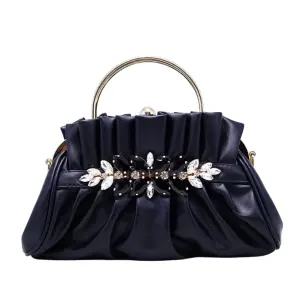 Vintage-inspired Black pleated Evening Clutch in "pouch" Silhouette with Opulent Hardware and Texture.