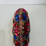 Gemstone-Encrusted Evening Clutch, with a multicolor Mosaic of Large Rhinestones and Crystals in various cuts like oval, teardrop, and marquise.