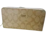 Coach Women's Long Zip Around Wallet in Signature Canvas.