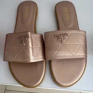 Prada Quilted Leather Slides.