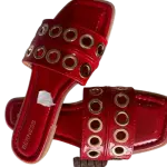 Berness Red Patent Grommet Slide Sandals.