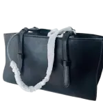 Zara Tote in Black is a sophisticated Handbag featuring Multiple storage areas for organization.