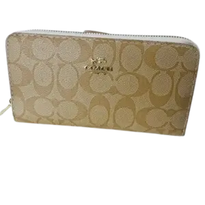 Coach Women's Long Zip Around Wallet in Signature Canvas.